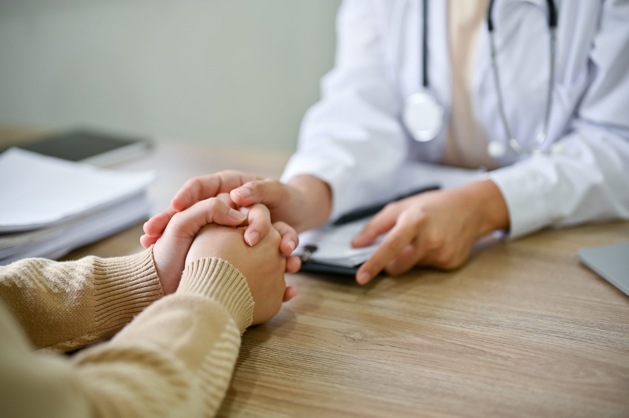 a doctor holding a patient's hand