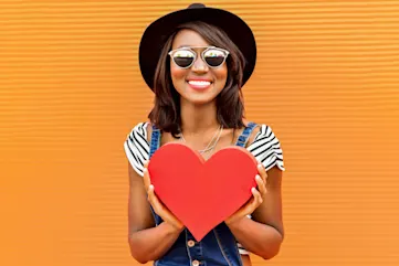 a woman holding a heart